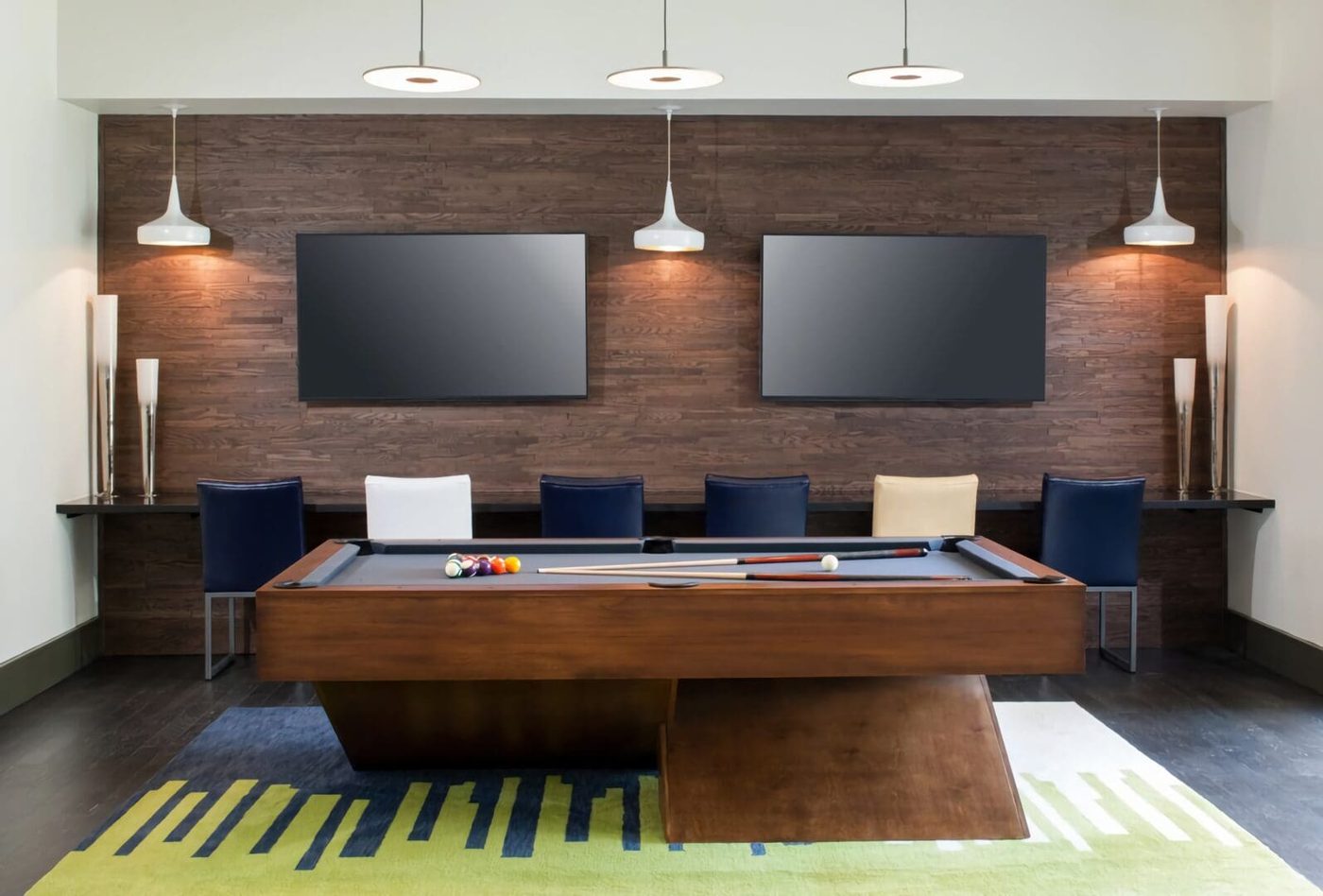 Game table and lounge furnishings in a recreation room