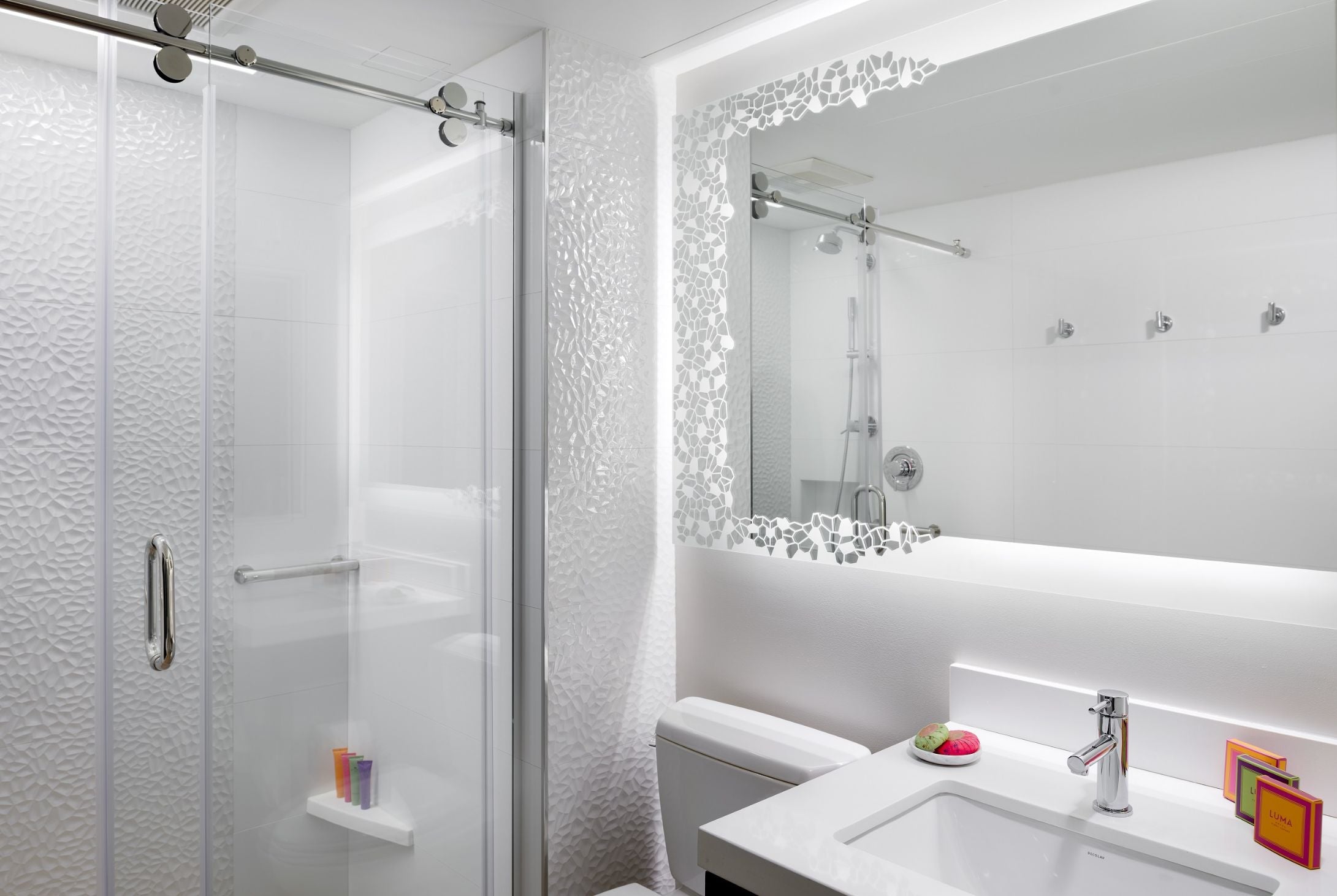 Lighted mirror in hospitality setting